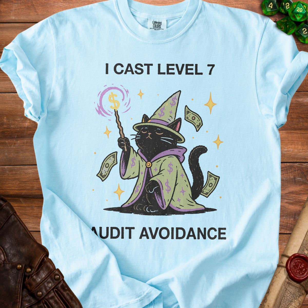 Black cat wizard with dollar signs on hat and robe, text reads "I CAST LEVEL 7 AUDIT AVOIDANCE".