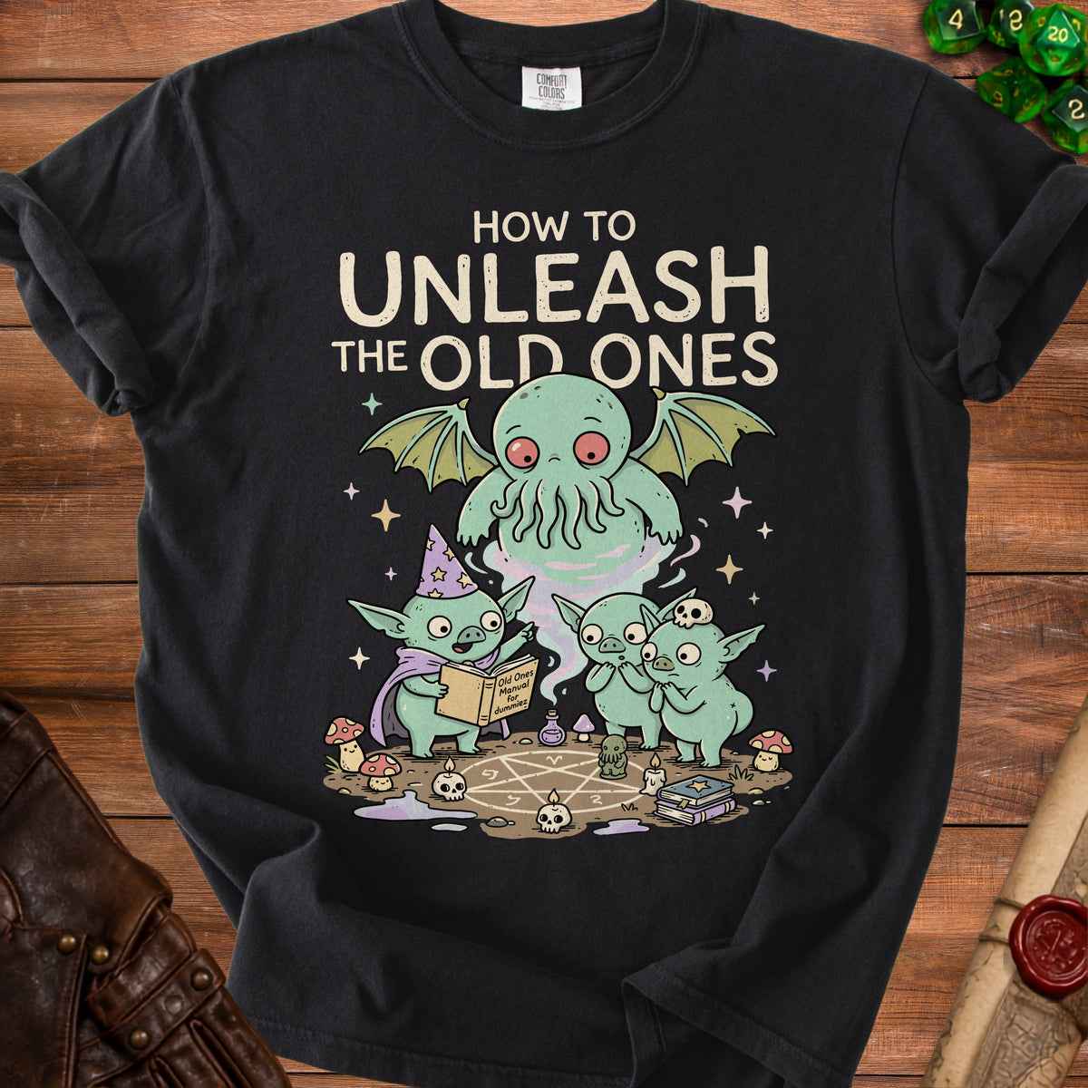 Black t-shirt with cartoon goblins studying "Old Ones Manual for Dummies" with Cthulhu above.