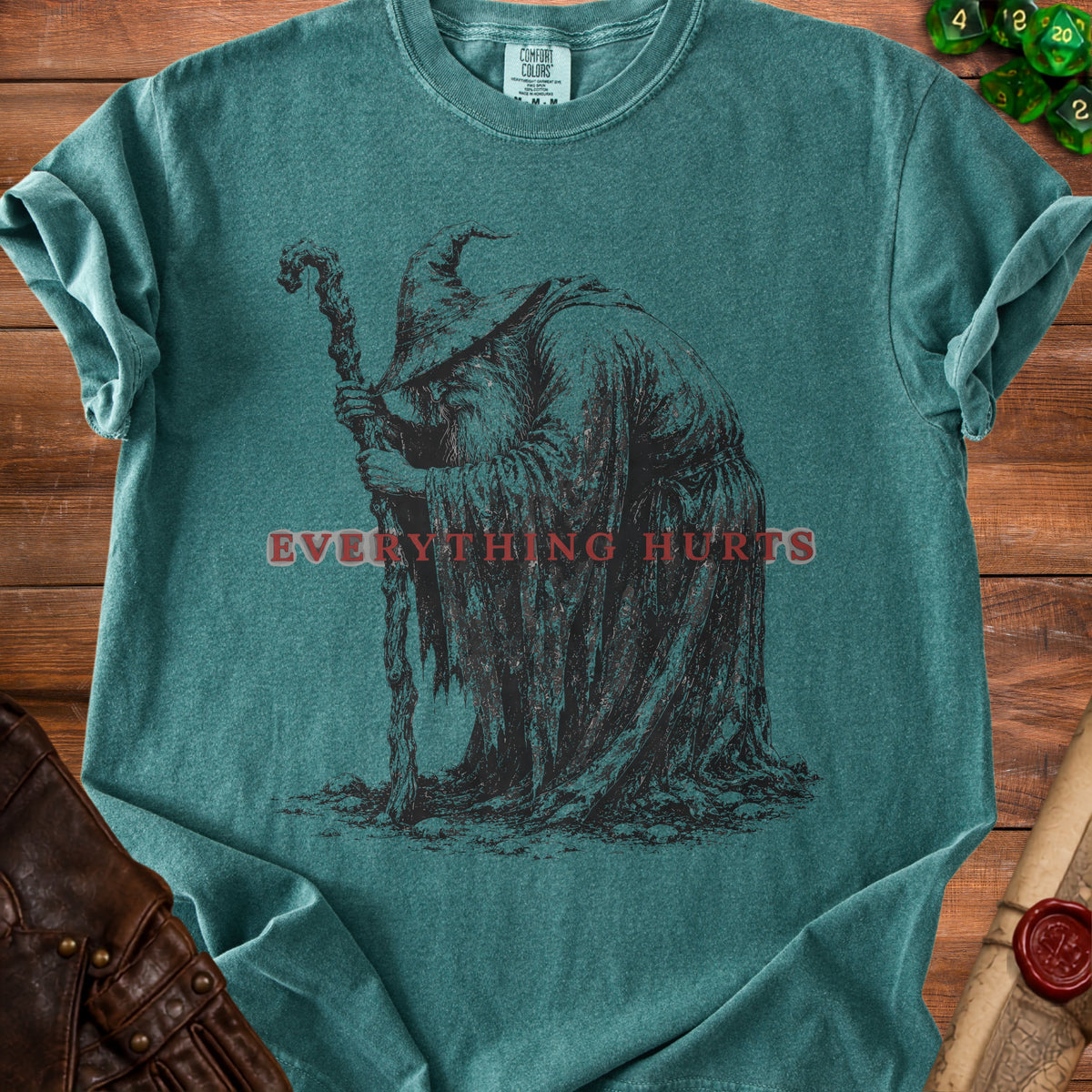 Teal t-shirt with wizard graphic and text "EVERYTHING HURTS".