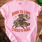 Pink t-shirt with goblin riding raccoon, "Born to Loot Cursed to Work" text.