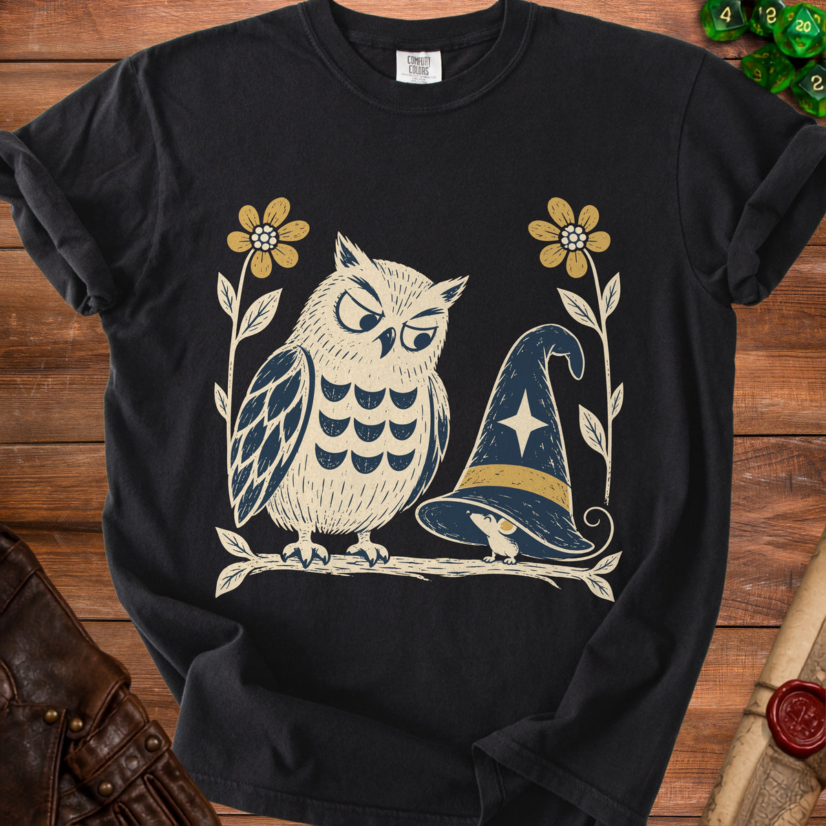 Black t-shirt with an owl, mouse, wizard hat, and flowers graphic.