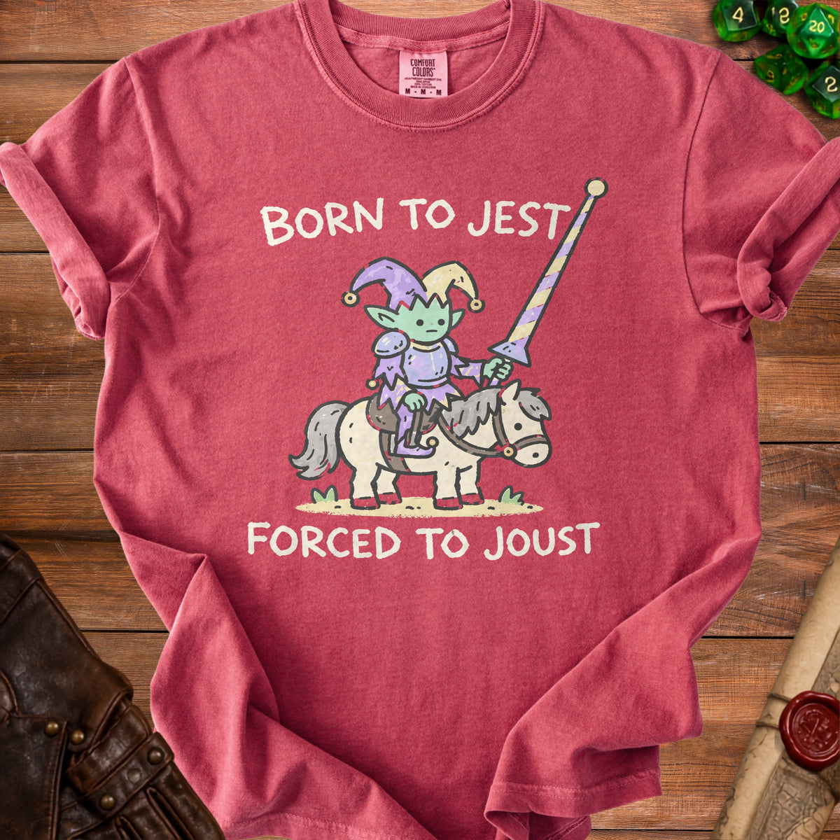 T-shirt with "Born to Jest Forced to Joust" text and jester riding a horse graphic.