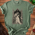 Green t-shirt with gothic illustration of a woman and imp reading a long scroll, text "SHOULD HAVE READ THE PACT".