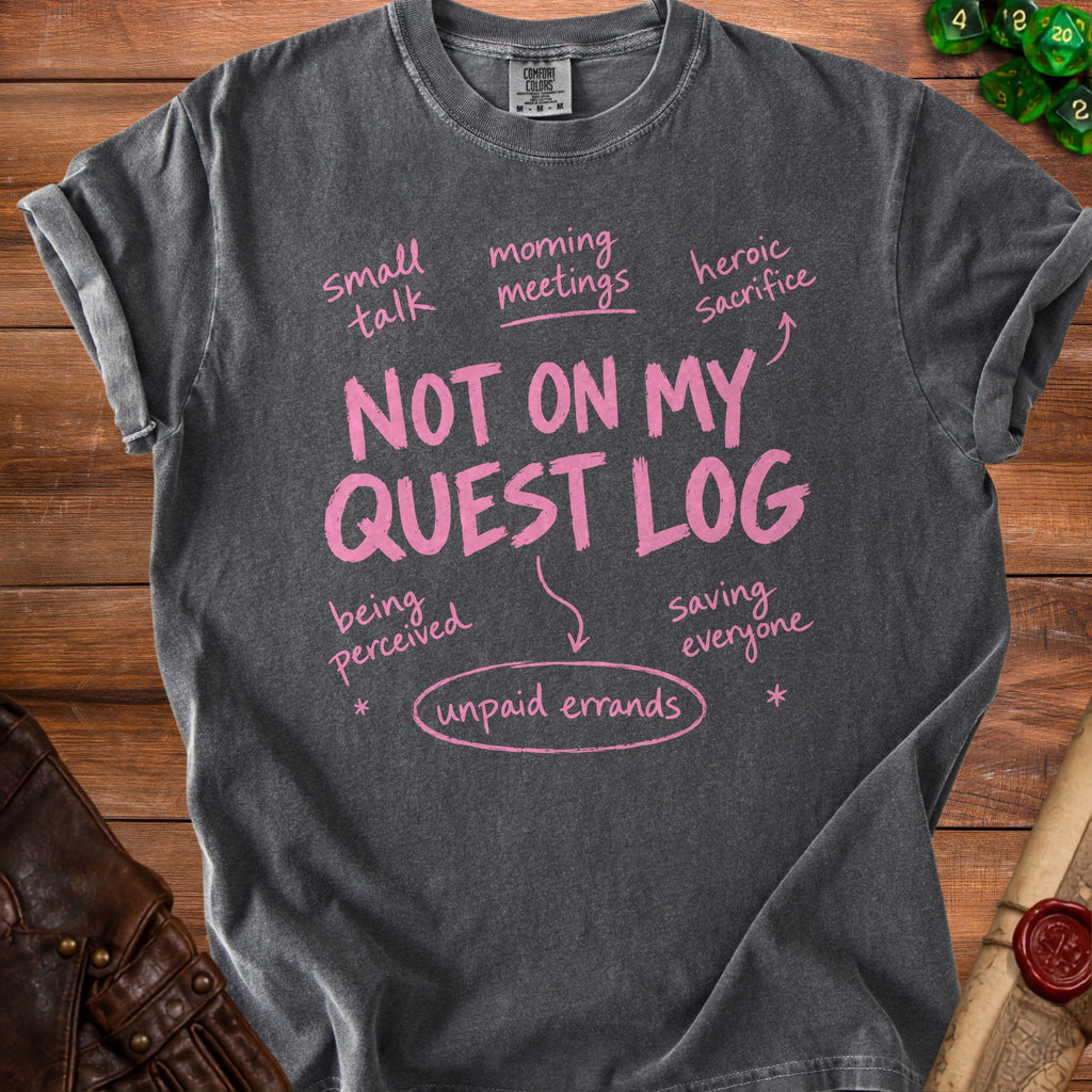 Dark grey t-shirt with pink text "Not on my quest log" and related phrases.