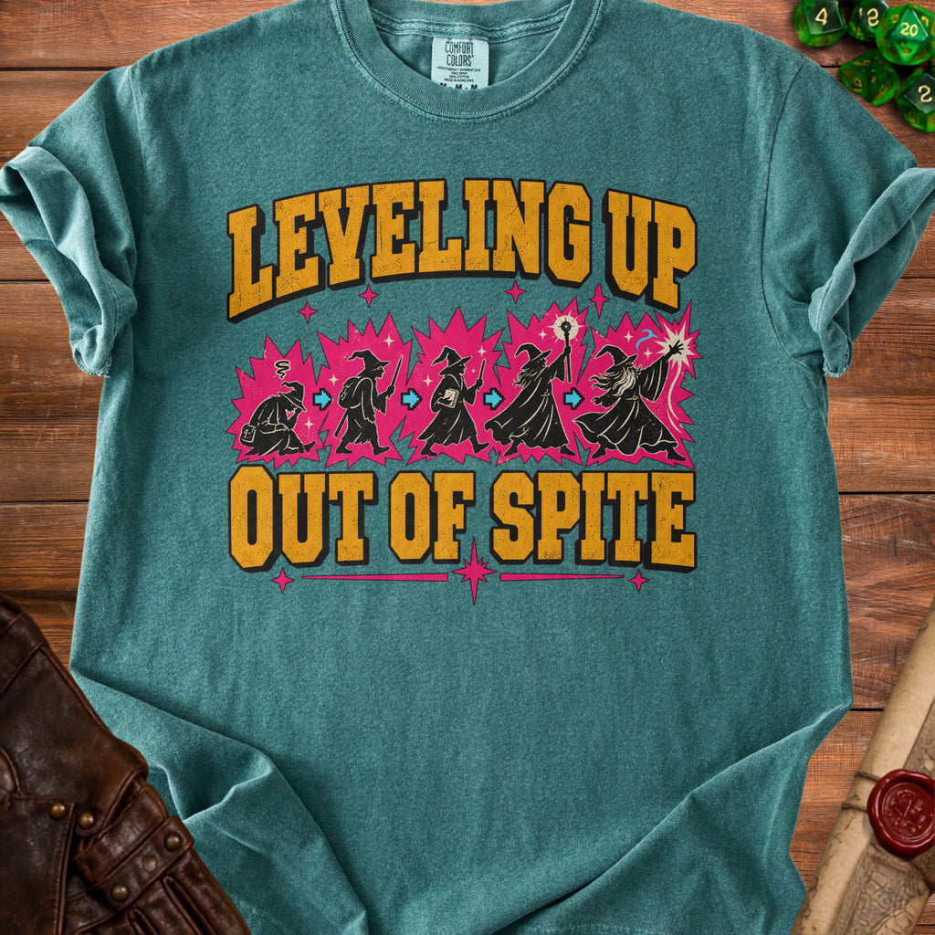 Teal t-shirt with "Leveling Up Out of Spite" text and wizard silhouettes.