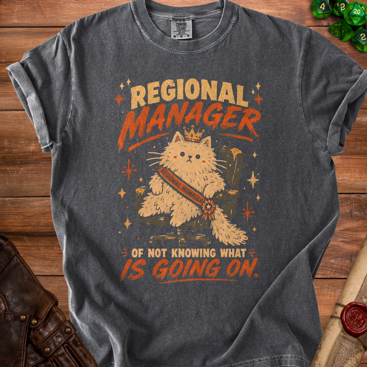 T-shirt with cat graphic reading "Regional Manager of Not Knowing What Is Going On".