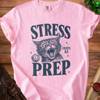 Pink t-shirt with distressed graphic of a screaming cat and text "STRESS COUNTS AS PREP".