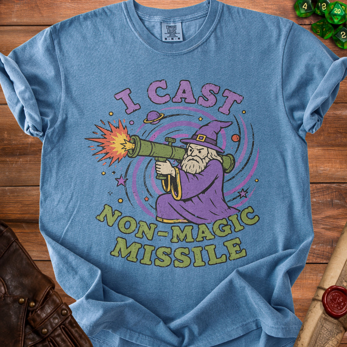 Blue t-shirt with a wizard firing a rocket launcher with text "I CAST NON-MAGIC MISSILE".