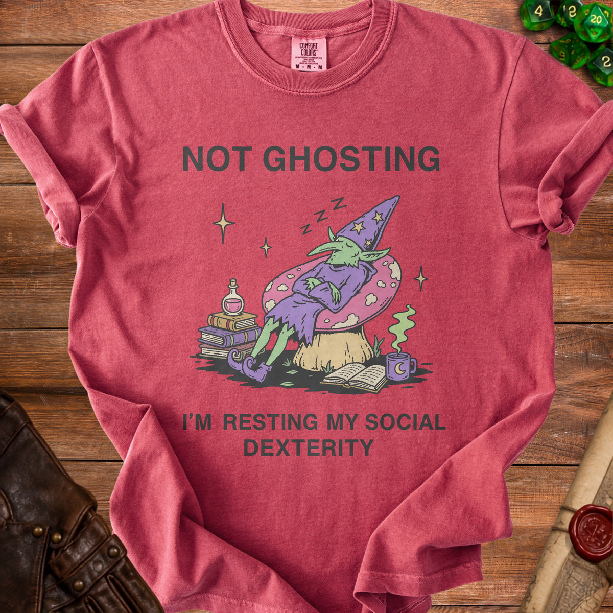 Red t-shirt with a graphic of a sleeping goblin and the text "NOT GHOSTING I'M RESTING MY SOCIAL DEXTERITY".