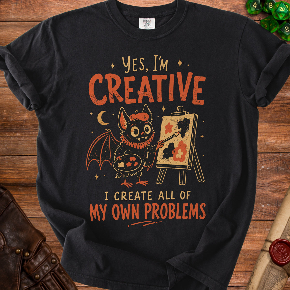 Black t-shirt with a bat artist and the text "Yes, I'm Creative. I Create All of My Own Problems."