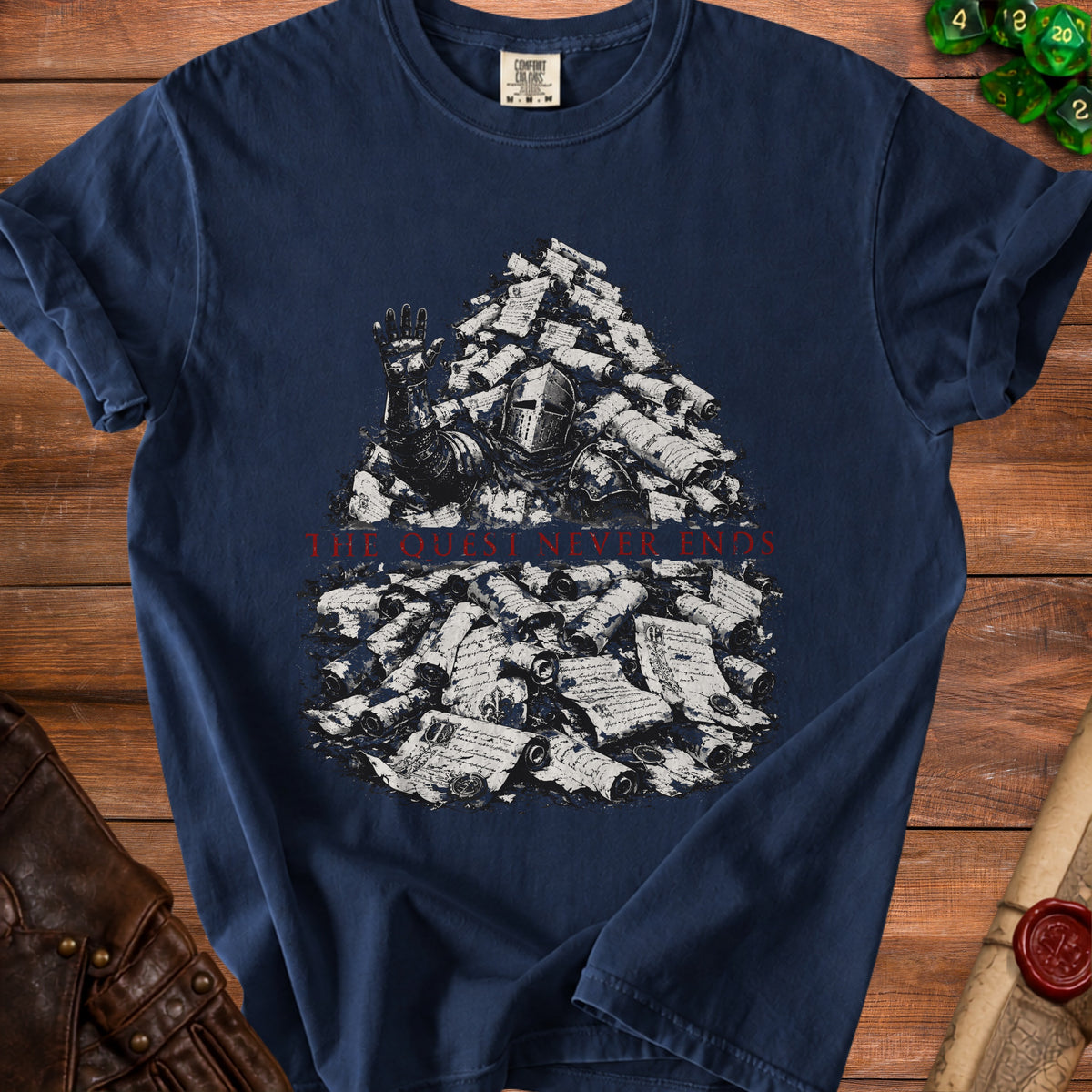 Dark blue t-shirt with knight submerged in scrolls, "THE QUEST NEVER ENDS" text.