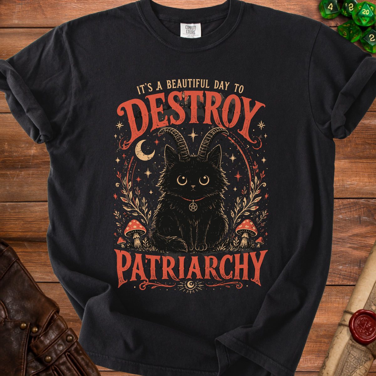 Black t-shirt with a distressed graphic of a black cat with horns and text.
