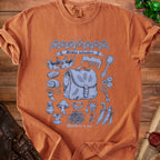 Orange t-shirt with "Goblin valuables" and "Worthless to you" text, featuring scattered treasures.