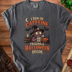 Dark gray t-shirt graphic with text "I run on caffeine, trauma & Halloween decor".