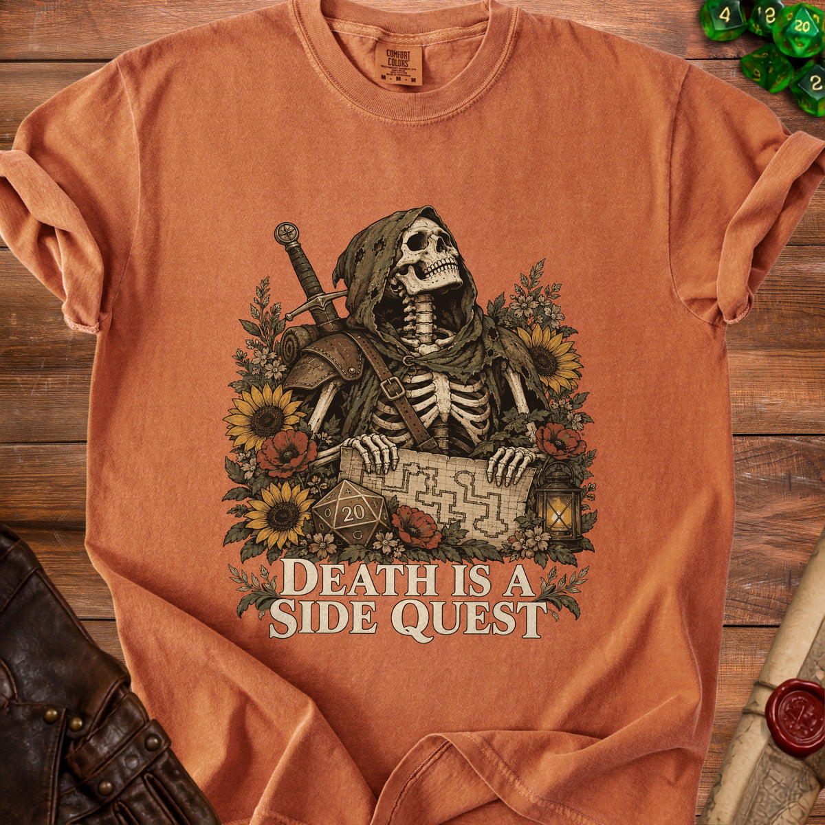 Skeleton in hooded cloak holds map surrounded by sunflowers with "DEATH IS A SIDE QUEST" text.