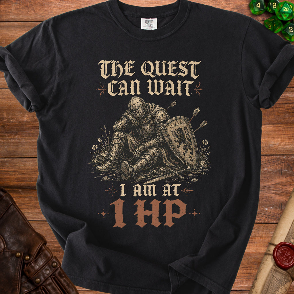 Black t-shirt with a knight sitting and text "The Quest Can Wait I Am At 1 HP".