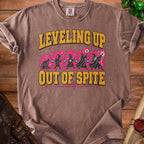 Brown t-shirt with yellow text "Leveling Up" and "Out of Spite".
