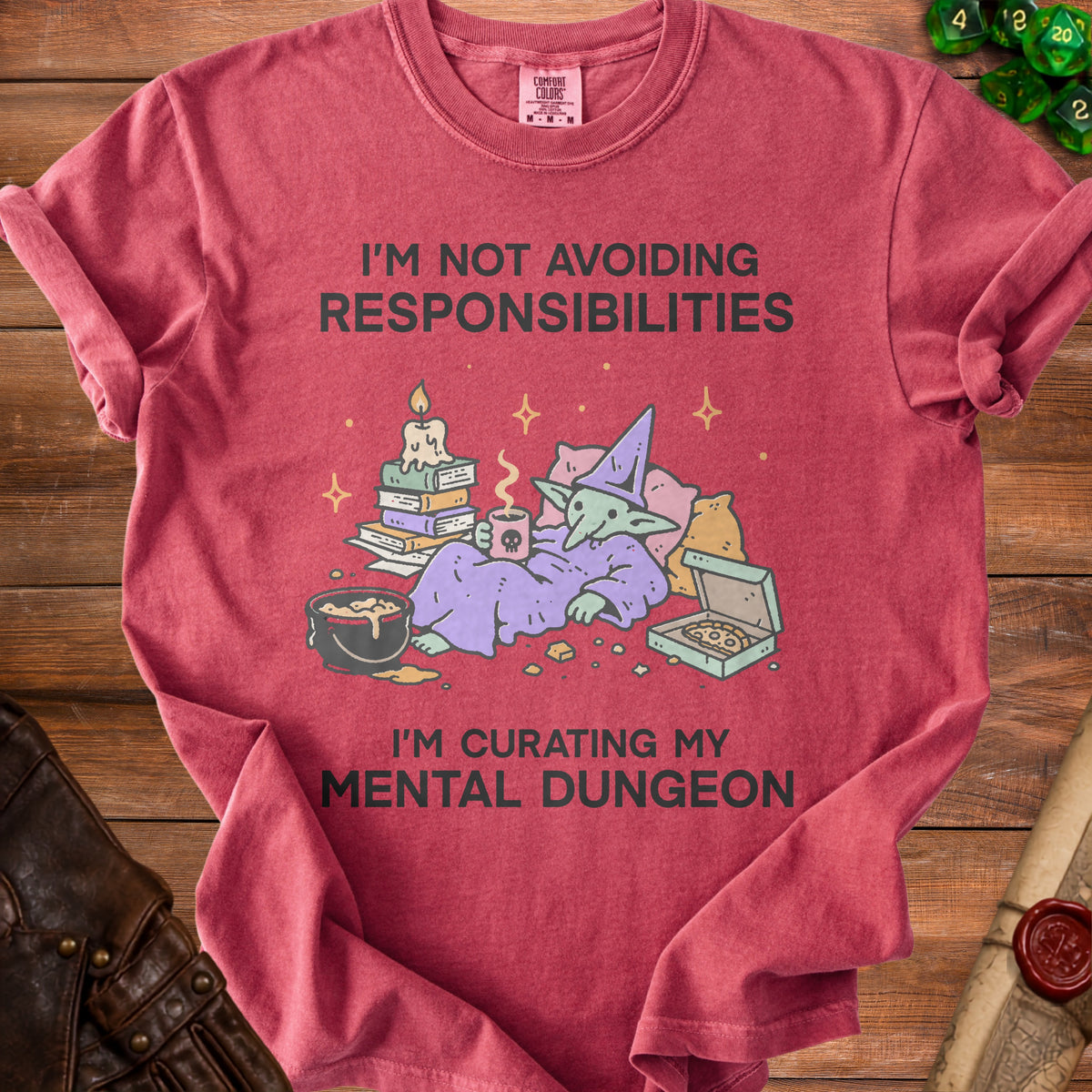 T-shirt with goblin graphic and text "I'M NOT AVOIDING RESPONSIBILITIES I'M CURATING MY MENTAL DUNGEON".