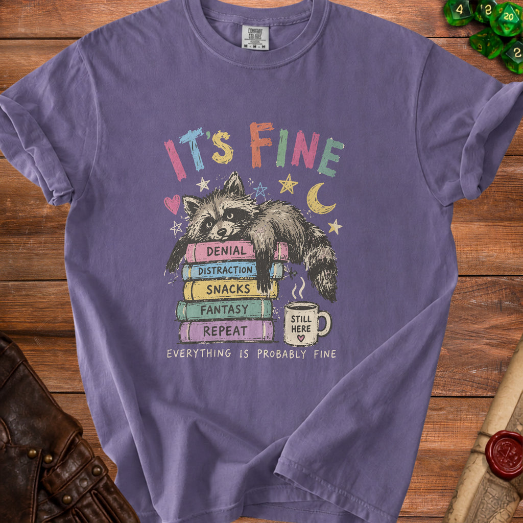Purple t-shirt with a raccoon on books and text "IT'S FINE EVERYTHING IS PROBABLY FINE".