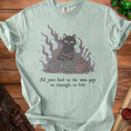Light green t-shirt with a grumpy cat tangled in yarn and the text "All you had to do was pay us enough to live".