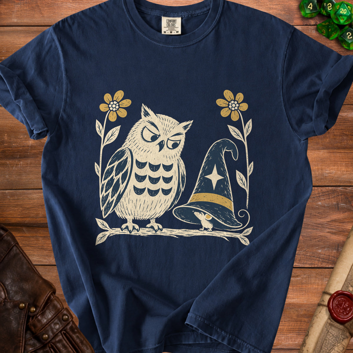 Navy t-shirt with graphic of owl and mouse near a witch hat and flowers.