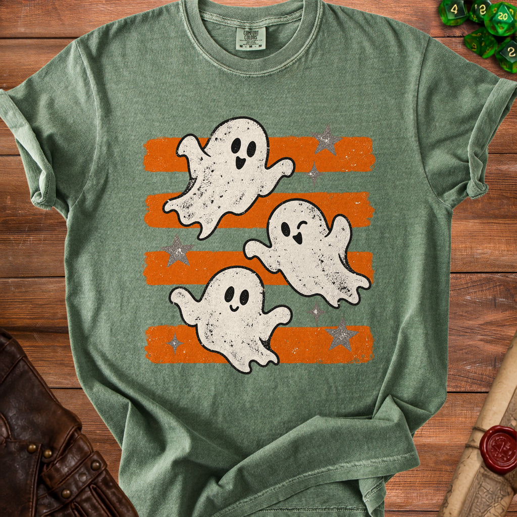 Green t-shirt with three cartoon ghosts and orange stripes.