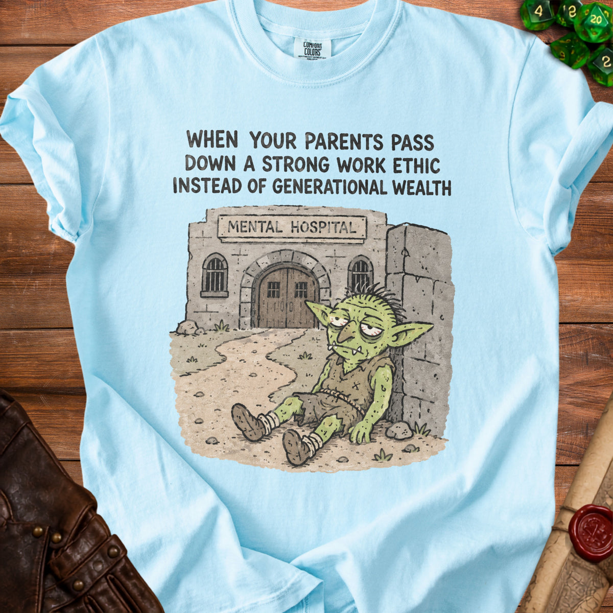 Light blue t-shirt with a goblin sitting outside a mental hospital with text about work ethic.