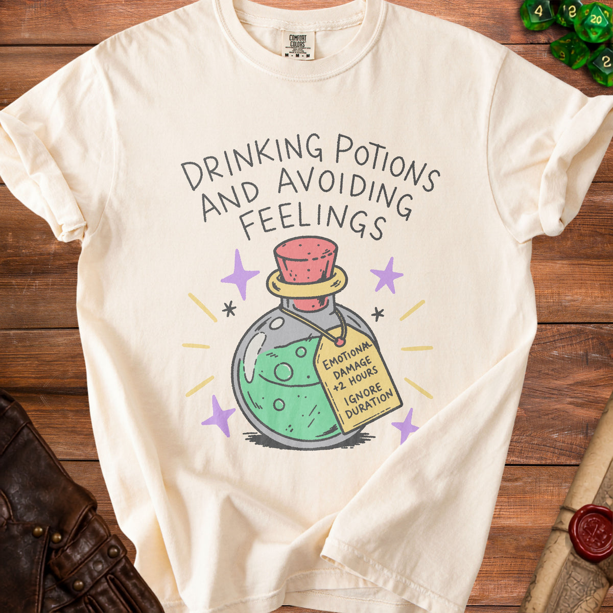 Cream t-shirt with "Drinking Potions and Avoiding Feelings" text and potion bottle graphic.