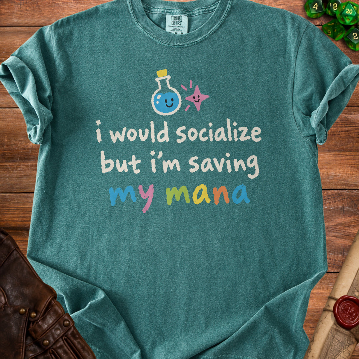 Teal Comfort Colors t-shirt with "I would socialize but I'm saving my mana" text and potion graphic.