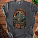 T-shirt with skeleton dancing, mountains, and text "The Sound of Existential Dread".