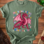 Green t-shirt with a pink dragon graphic and text "MY BOUNDARIES HAVE TEETH".