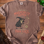 Brown t-shirt with wizard graphic and text "Things don't magically happen. Create your own luck."