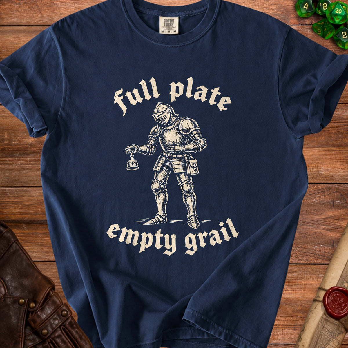 Navy blue t-shirt featuring a vintage line-art illustration of a knight holding a small bell, with the text full plate empty grail.