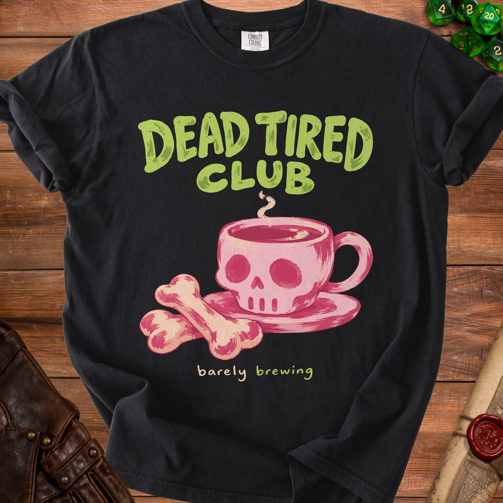 Black t-shirt with "Dead Tired Club" and "barely brewing" text with skull and bones graphic.