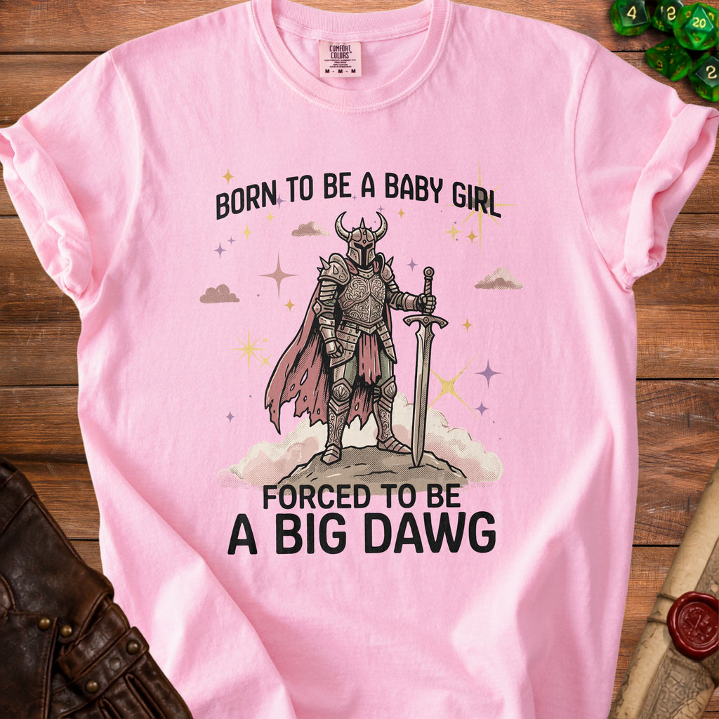 Pink t-shirt with "Born to be a baby girl, forced to be a big dawg" text and knight illustration.