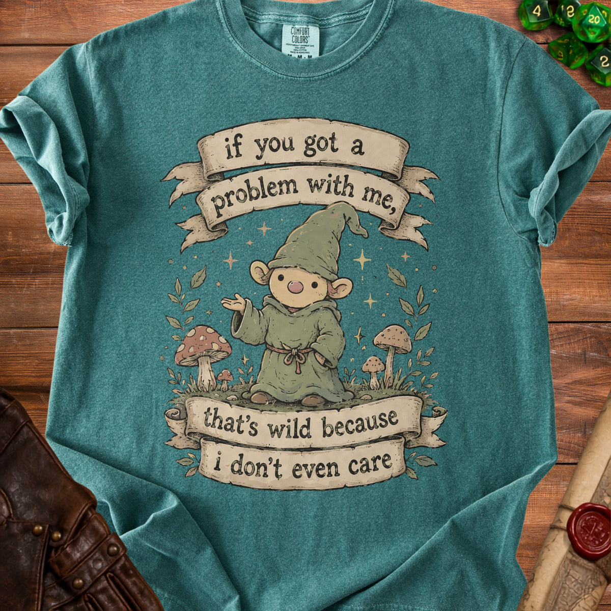 Teal t-shirt with gnome graphic and text "if you got a problem with me, that's wild because i don't even care".