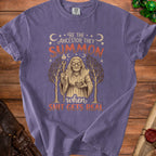 Purple t-shirt with "Be the ancestor they summon" and witch graphic.