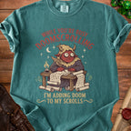 Teal t-shirt with a red devil writing "While you're busy doomscrolling I'm adding doom to my scrolls."