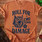 Orange t-shirt with a distressed graphic of an owl and dice, reading "Roll for Emotional Damage".