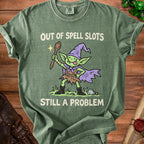 Green t-shirt with a goblin holding a spoon, reading "Out of Spell Slots Still a Problem."
