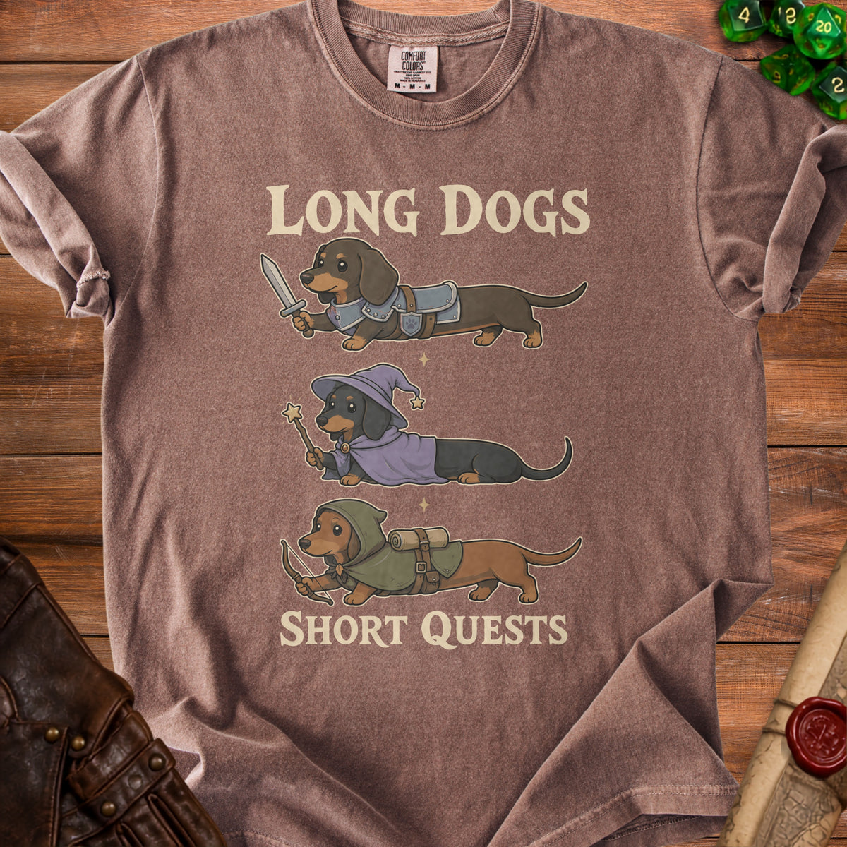 T-shirt with three dachshunds: knight, wizard, and archer, reading "Long Dogs Short Quests."