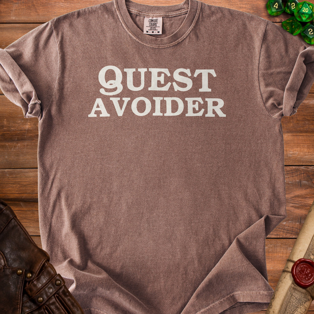 Brown t-shirt with "QUEST AVOIDER" printed in white text.