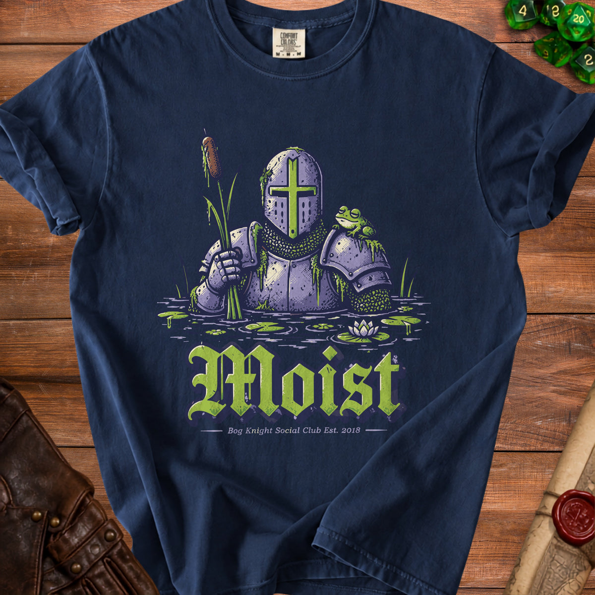 Knight in armor standing in swamp with frog and text "Moist".