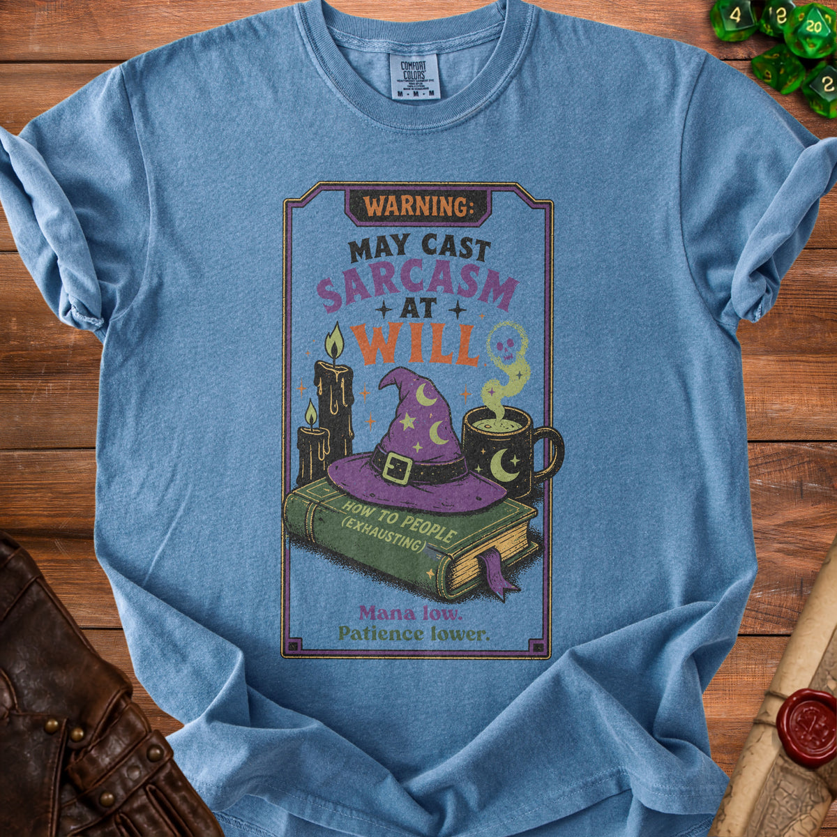 T-shirt with "WARNING: MAY CAST SARCASM AT WILL" and wizarding elements.