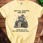Yellow t-shirt with "Not All Quests Are Epic" and a goblin wizard with to-do list.