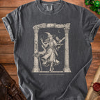 T-shirt with a witch and owl illustration, text "Trying to Maintain Concentration".