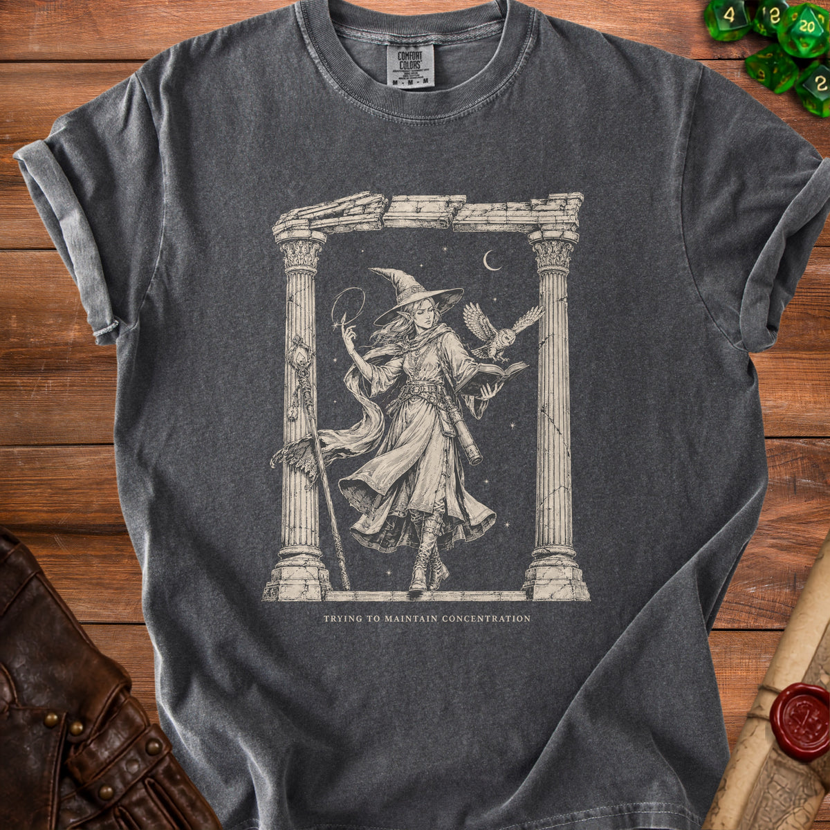 T-shirt with a witch and owl illustration, text "Trying to Maintain Concentration".