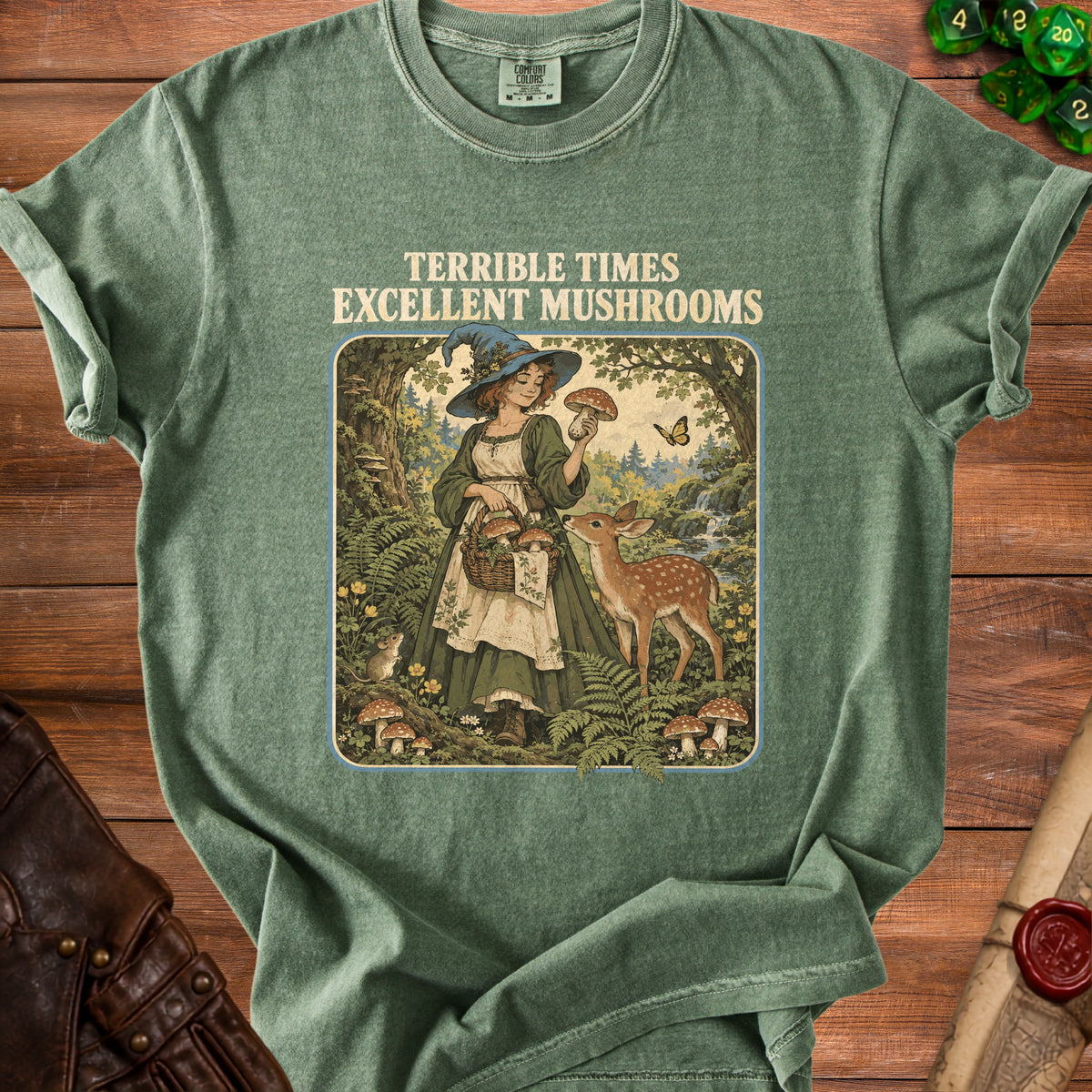 T-shirt with "Terrible Times Excellent Mushrooms" text, witch, deer, and mushrooms.