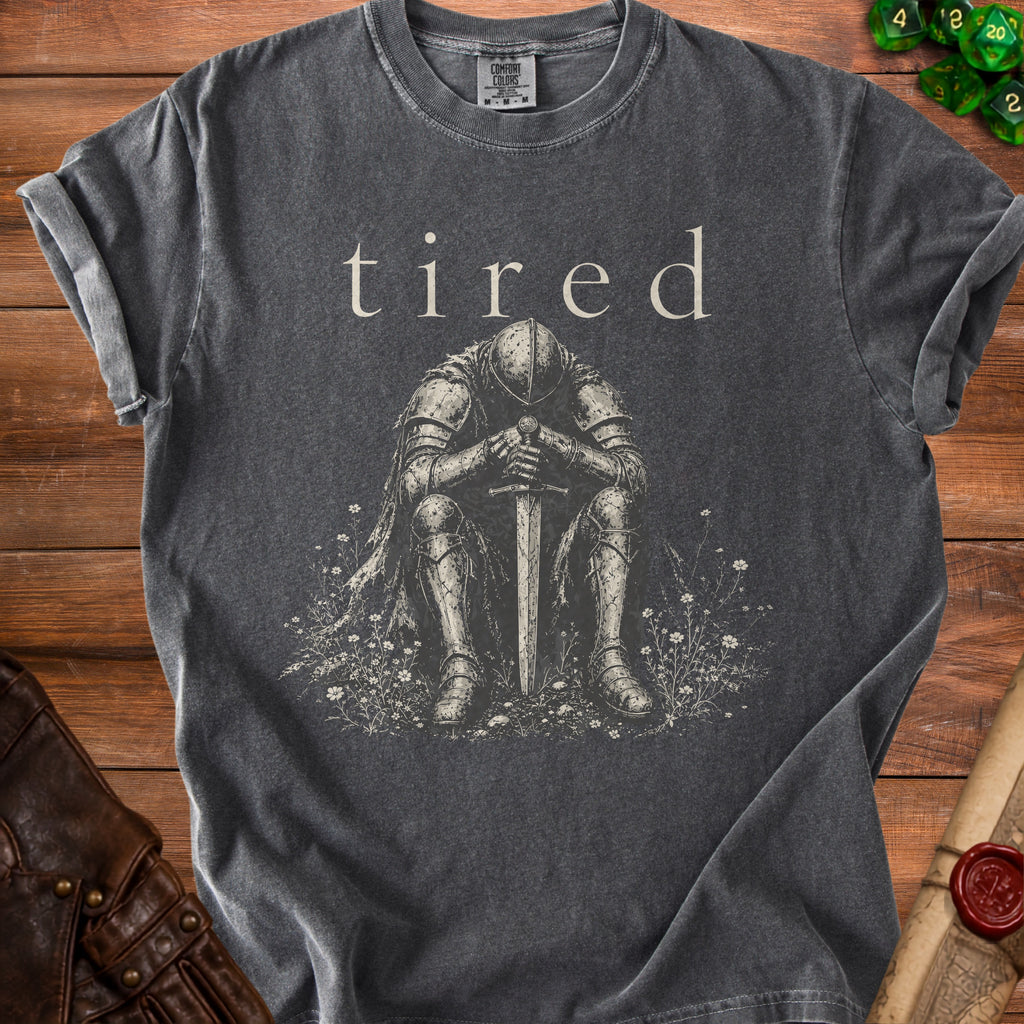 Charcoal Comfort Colors t-shirt with text "tired" and graphic of a knight sitting.