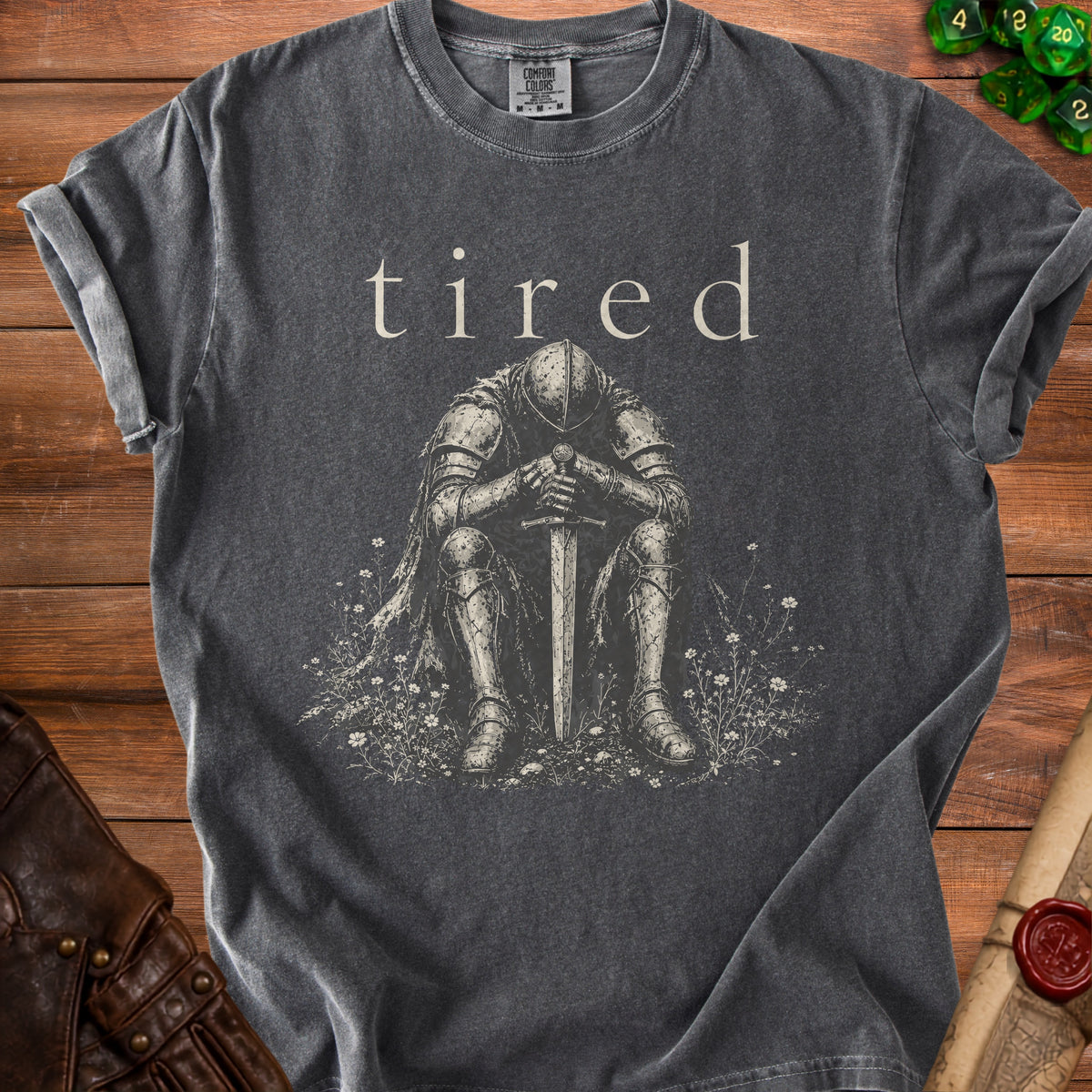 Charcoal Comfort Colors t-shirt with text "tired" and graphic of a knight sitting.